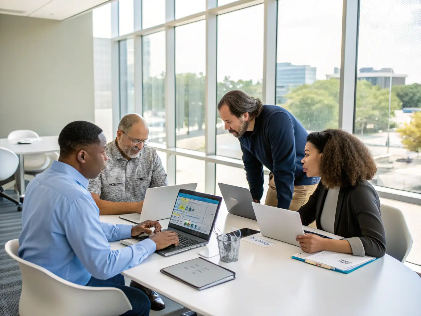 An image showcasing a team of consultants collaborating with a client on a digital transformation strategy, using tablets and interactive displays to visualize data and plan the implementation.